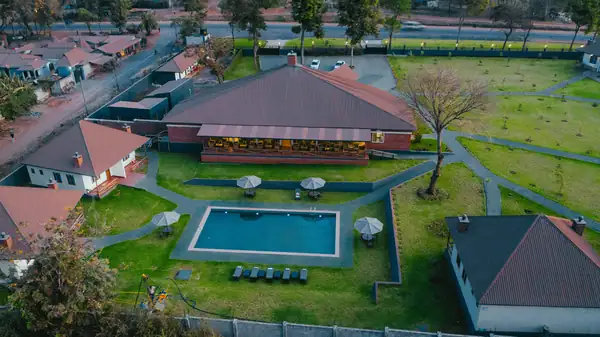 Aerial view of the main building, pool and lawns
