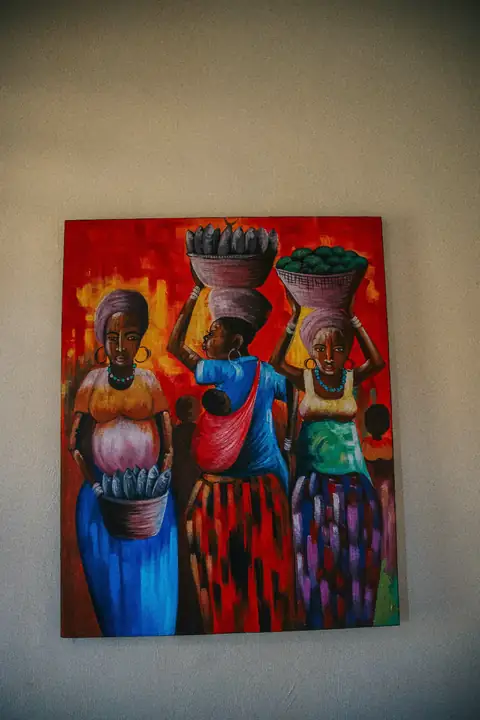 Colourful painting of women carrying baskets