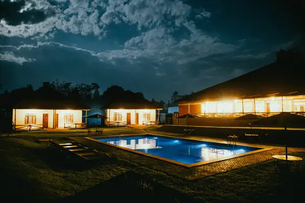 Pool at dusk under a cloudy sky