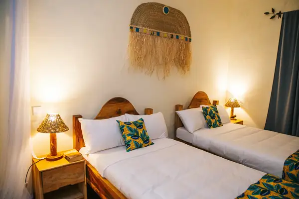 Twin beds with yellow-and-green cushions