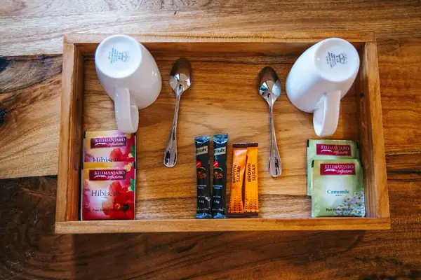 Tea and coffee tray with cups and sachets